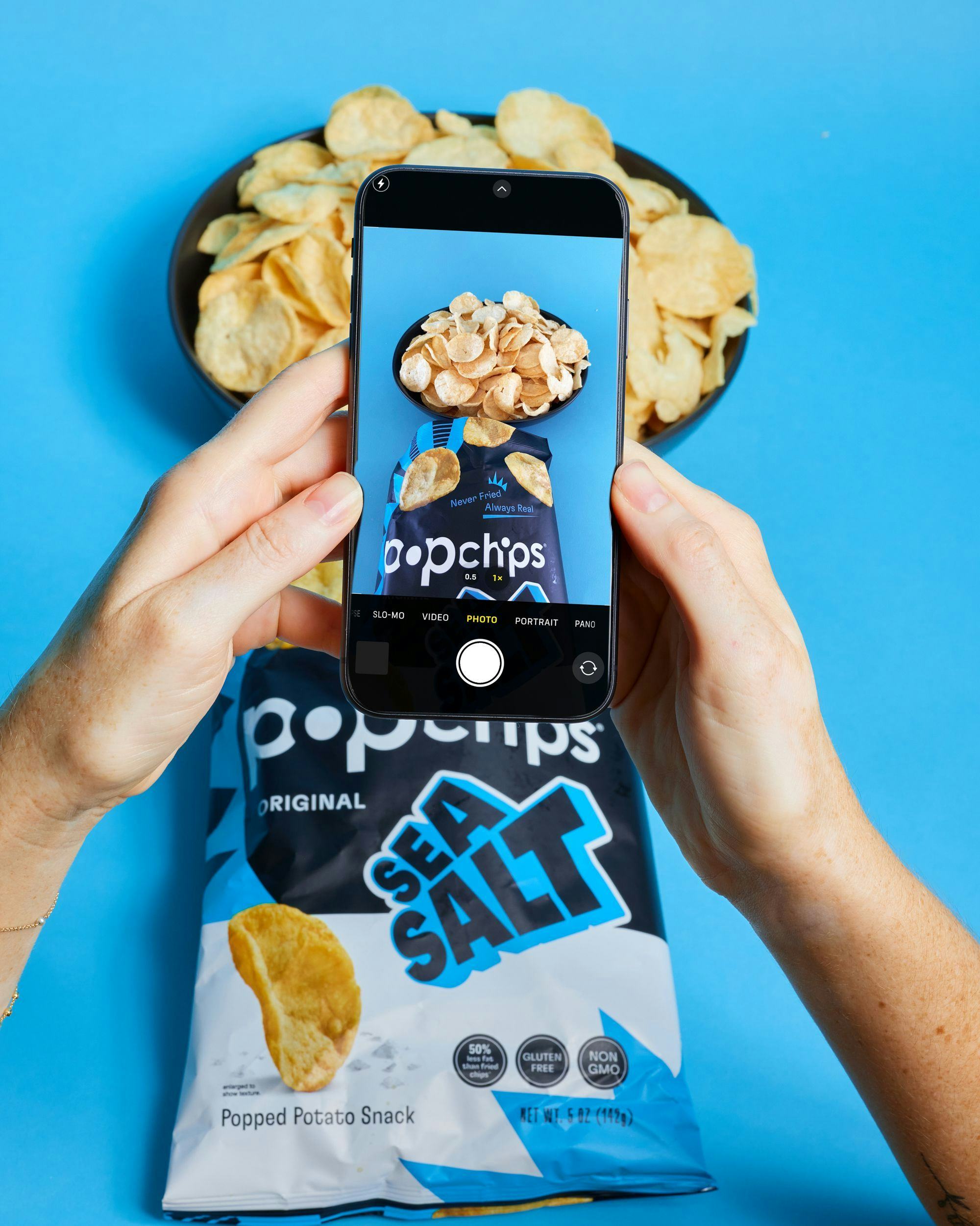 Person taking picture of Popchips